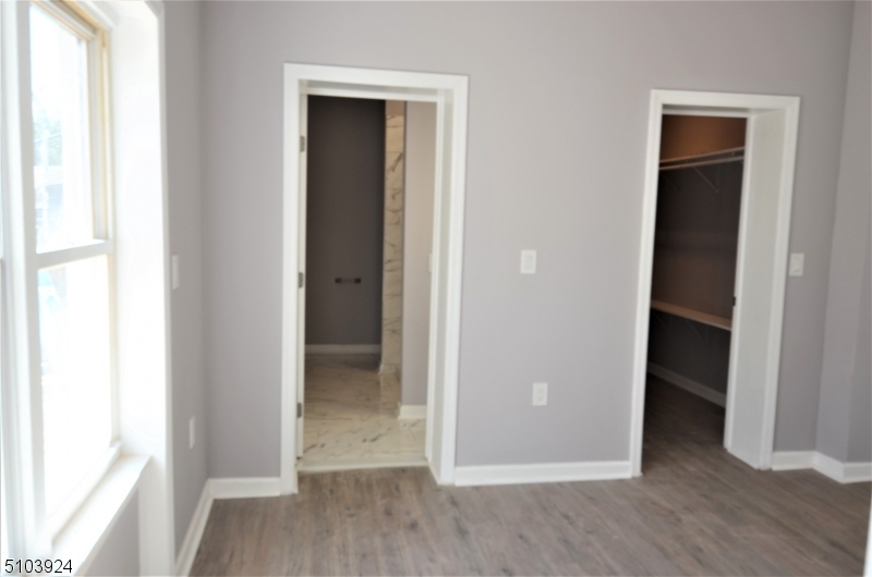 154 South Main Street Phillipsburg, NJ 08865 - Photo 6 of 12 a view of a hallway with wooden floor and closet