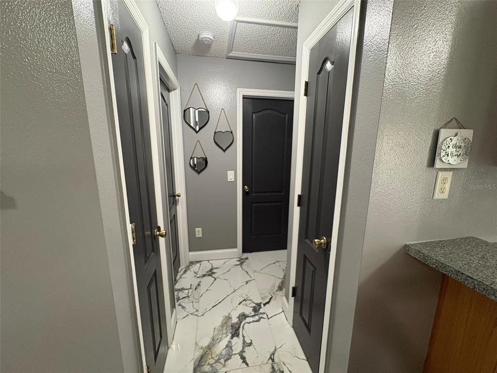 3123 East Marcia Street Inverness, FL 34453 - Photo 19 of 32 a bathroom with a shower and a mirror