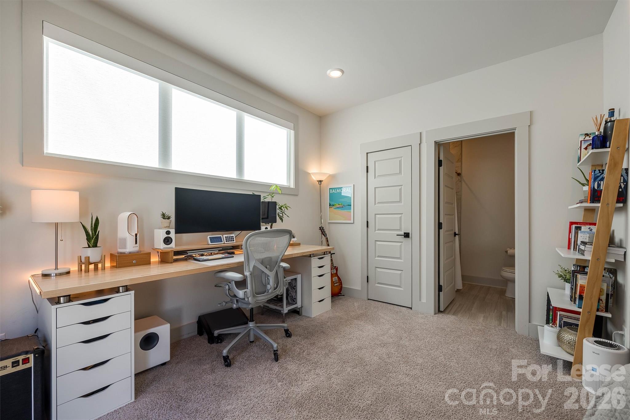 2319 Wesley Village Road Charlotte, NC 28208 - Photo 10 of 44 a view of a workspace with furniture and a window
