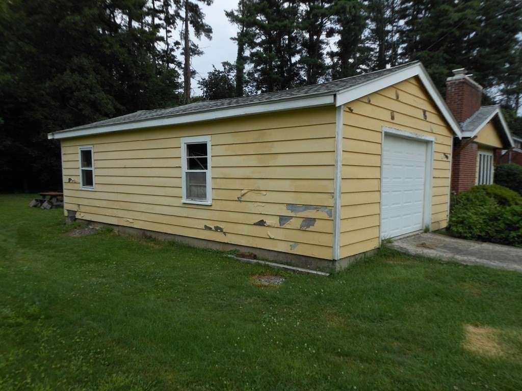 26 Bigelow Road Lancaster, MA 01523 - Photo 20 of 26 a view of a house with a backyard