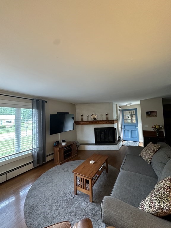 26 Bigelow Road Lancaster, MA 01523 - Photo 2 of 26 a living room with furniture window and a fireplace