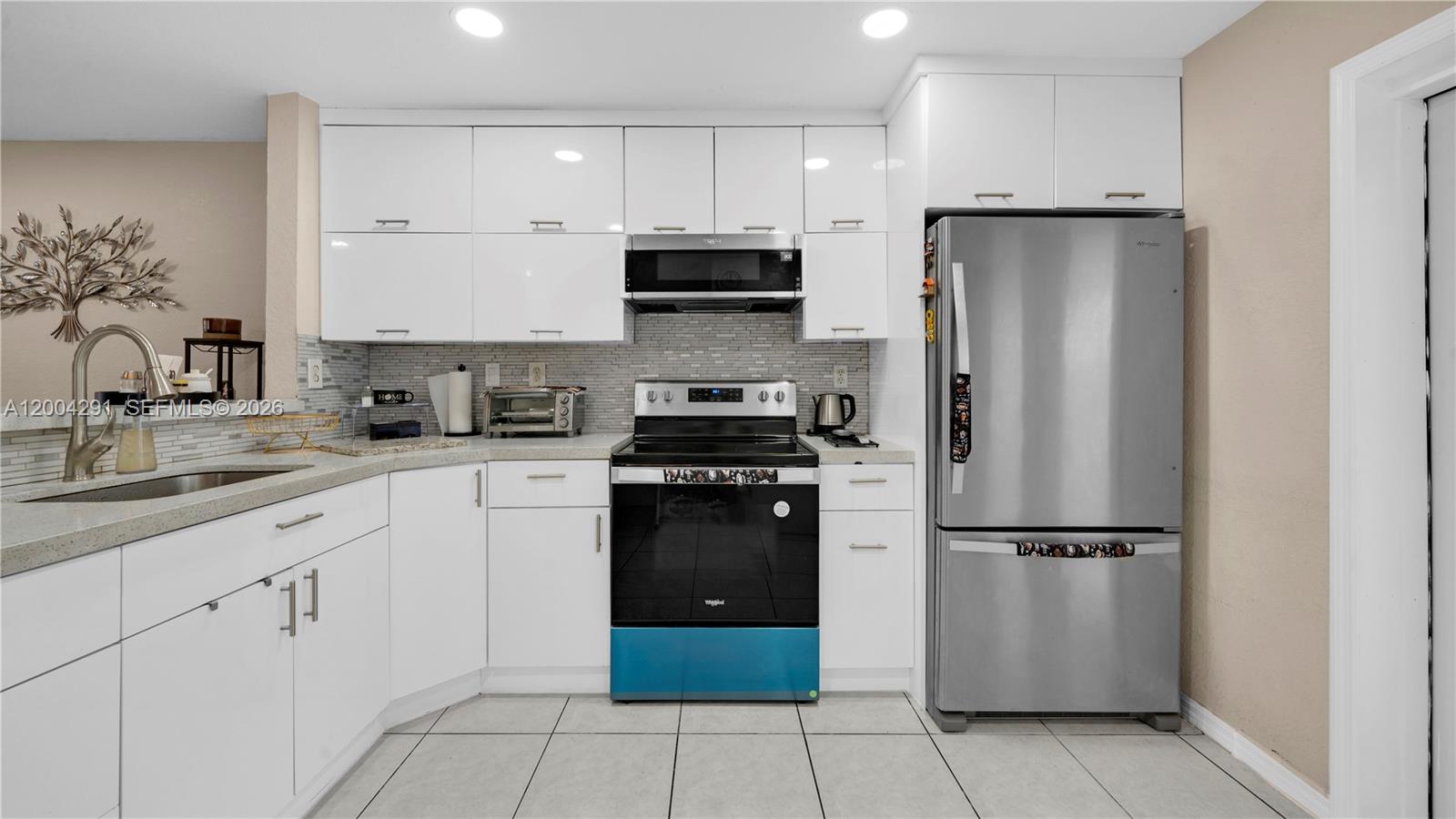 120 East 5th Street, Unit 2 Hialeah, FL 33010 - Photo 12 of 42 a kitchen with cabinets and stainless steel appliances