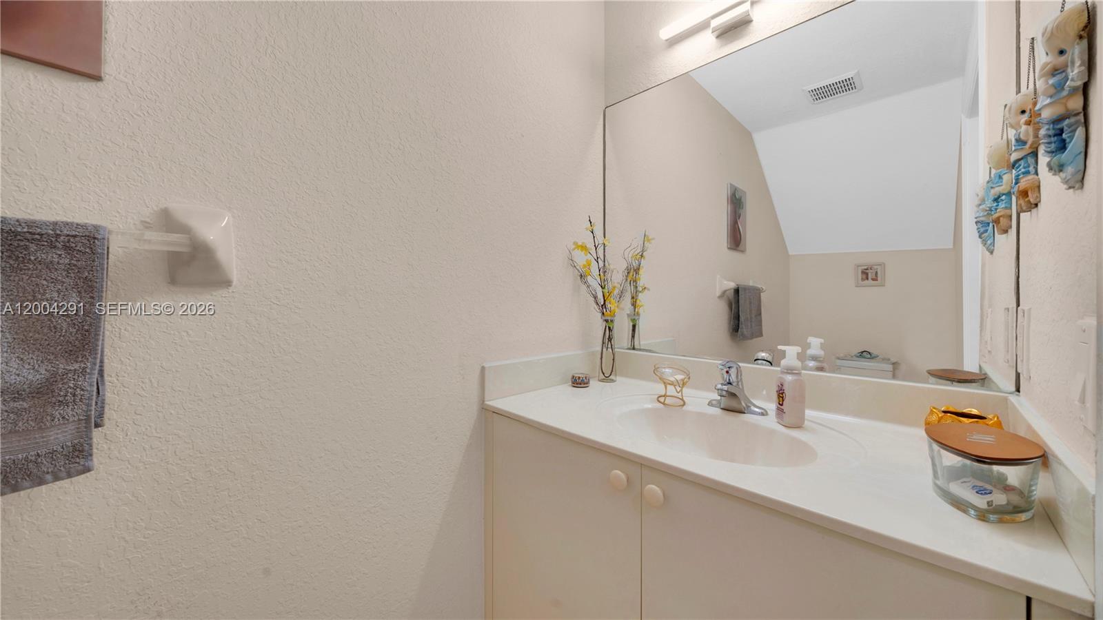 120 East 5th Street, Unit 2 Hialeah, FL 33010 - Photo 18 of 42 a bathroom with a sink and a mirror