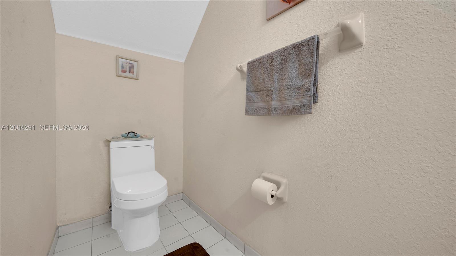 120 East 5th Street, Unit 2 Hialeah, FL 33010 - Photo 19 of 42 a white toilet sitting next to a white sink and vanity