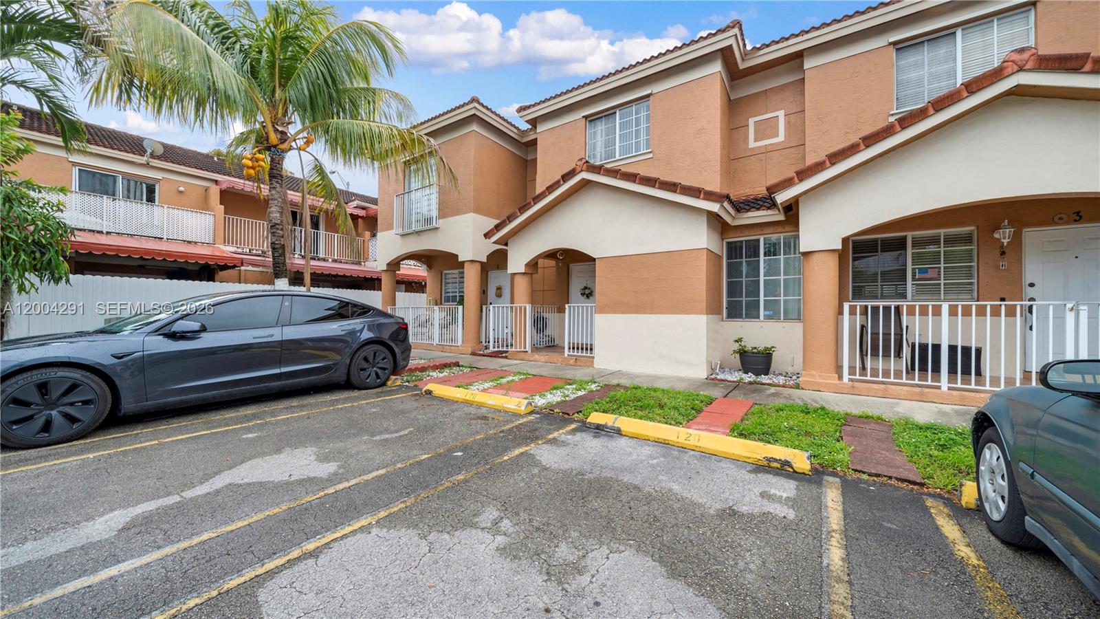 120 East 5th Street, Unit 2 Hialeah, FL 33010 - Photo 2 of 42 a view of a car park in front of a house