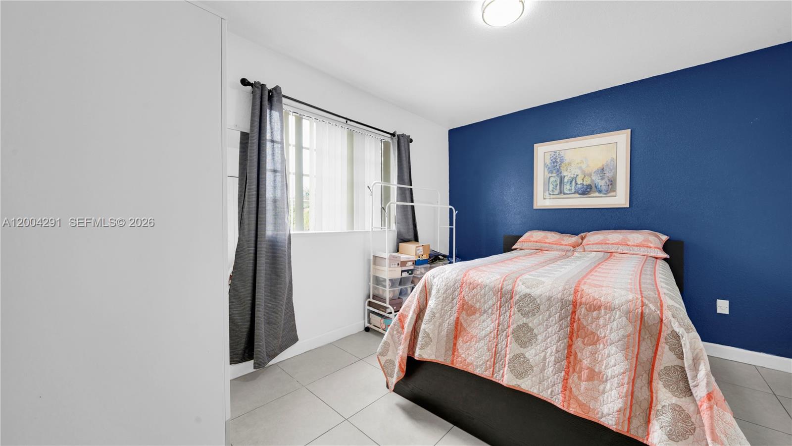 120 East 5th Street, Unit 2 Hialeah, FL 33010 - Photo 24 of 42 a bedroom with a bed and a window