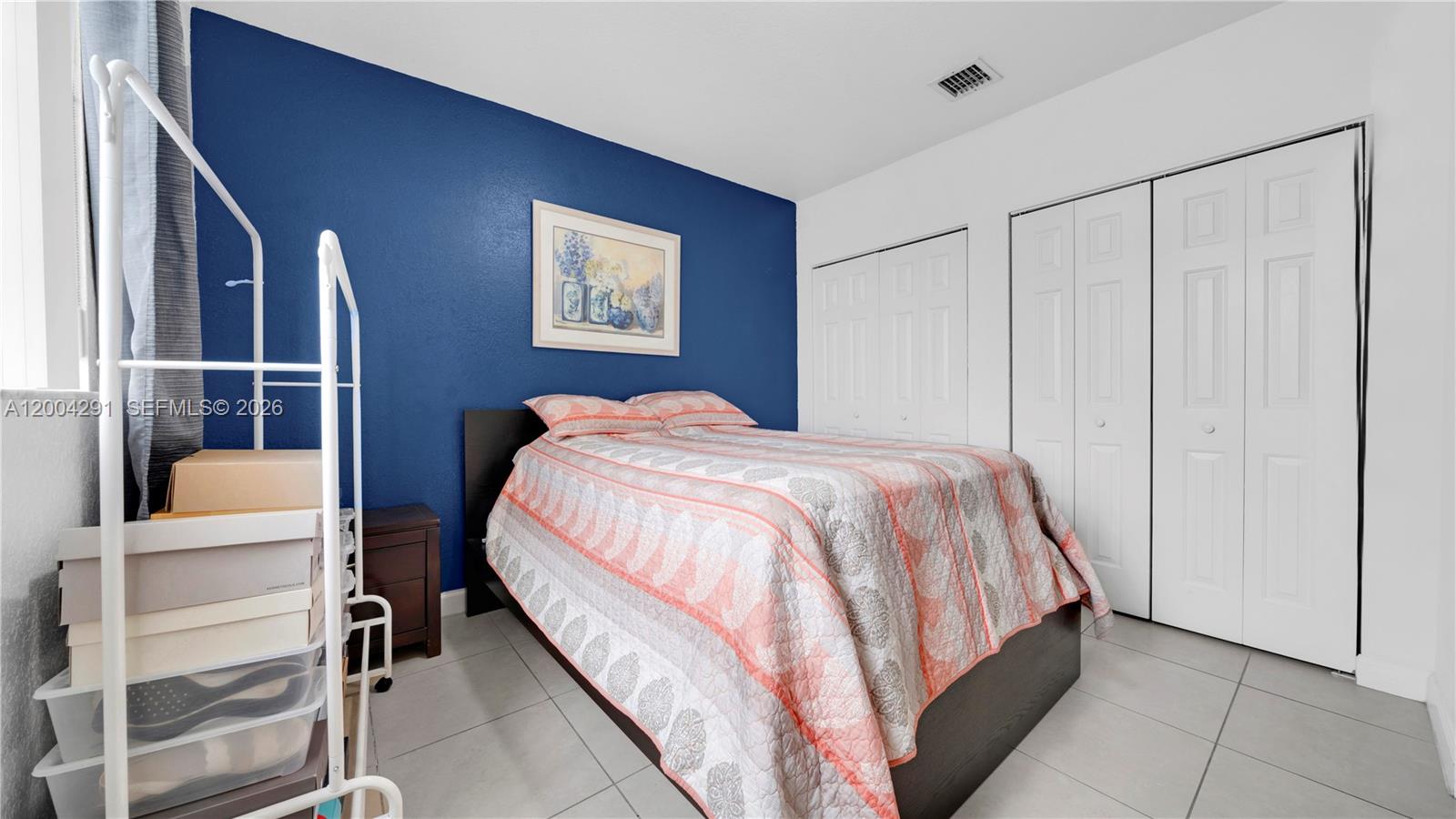 120 East 5th Street, Unit 2 Hialeah, FL 33010 - Photo 25 of 42 a bed sitting in a bedroom next to a bathroom