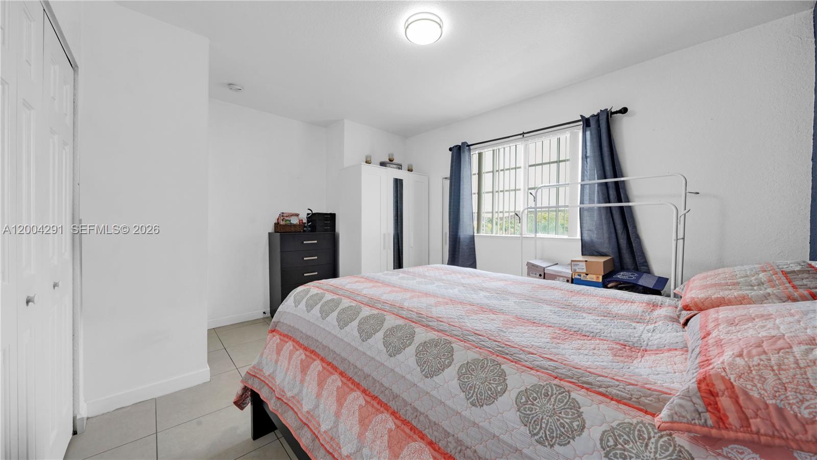 120 East 5th Street, Unit 2 Hialeah, FL 33010 - Photo 26 of 42 a bedroom with a bed and a window