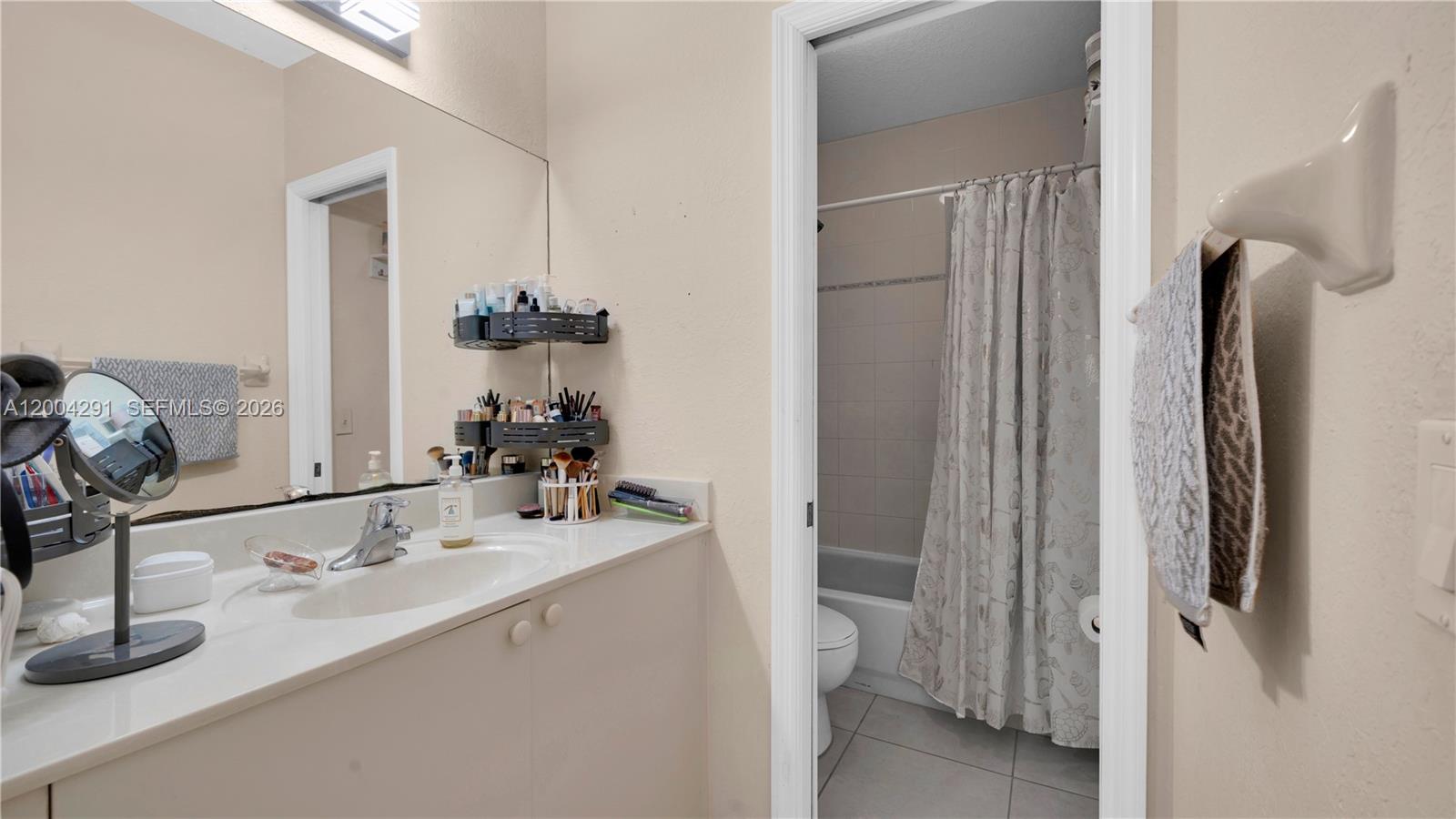 120 East 5th Street, Unit 2 Hialeah, FL 33010 - Photo 34 of 42 a bathroom with a sink and a mirror
