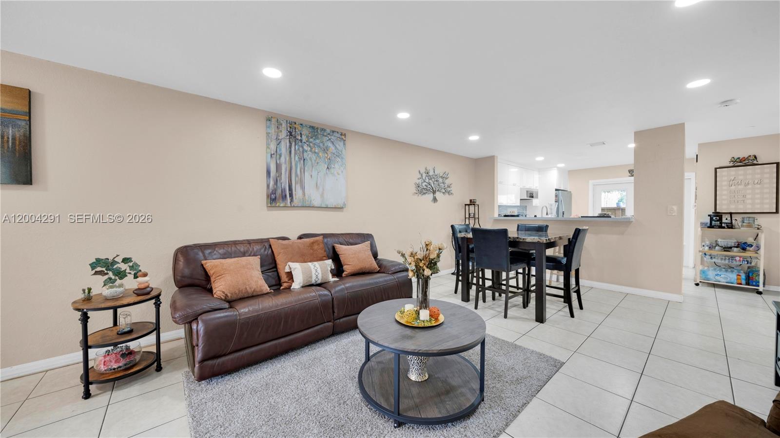 120 East 5th Street, Unit 2 Hialeah, FL 33010 - Photo 6 of 42 a living room with furniture and kitchen view