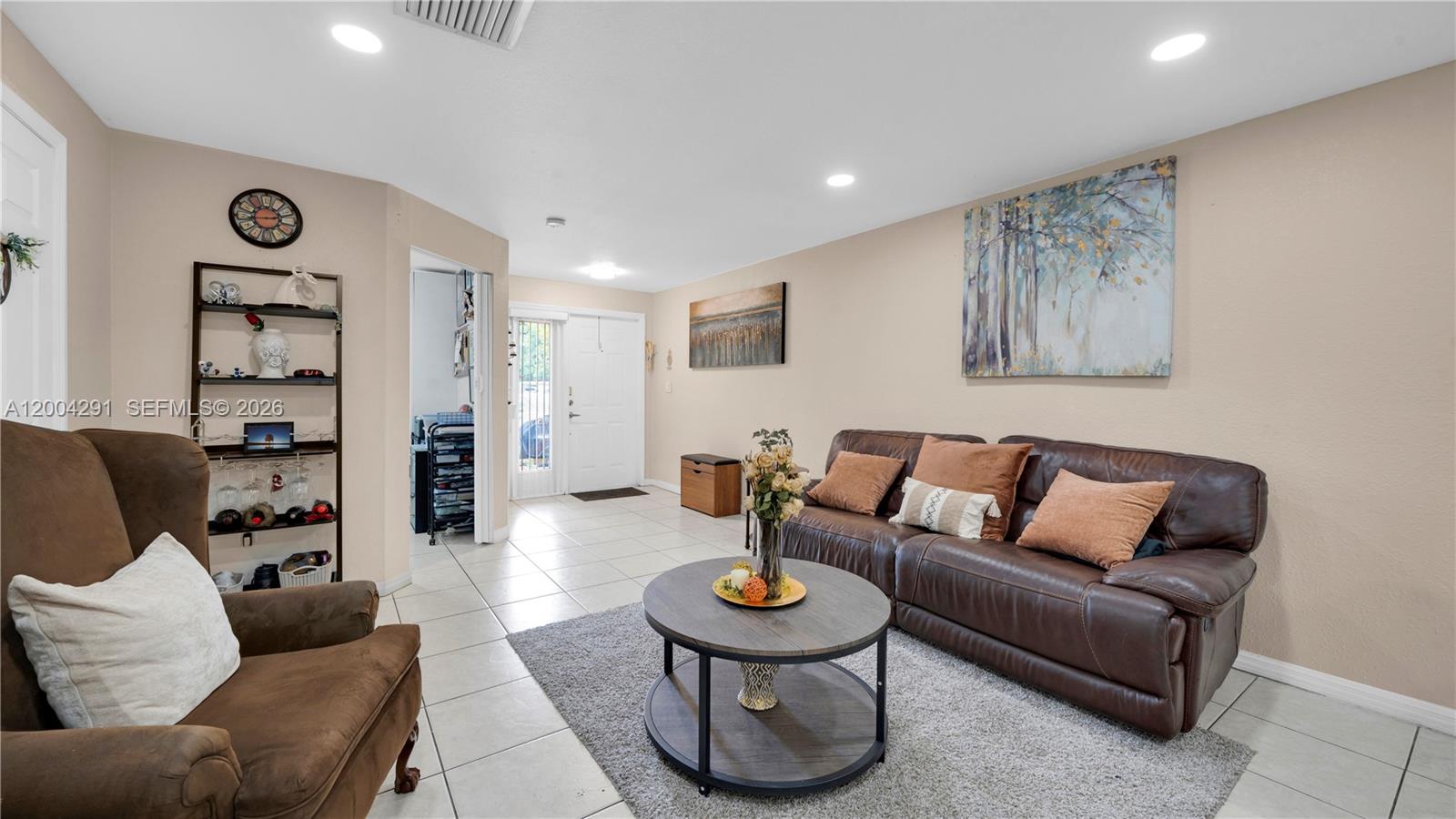 120 East 5th Street, Unit 2 Hialeah, FL 33010 - Photo 7 of 42 a living room with furniture and a table
