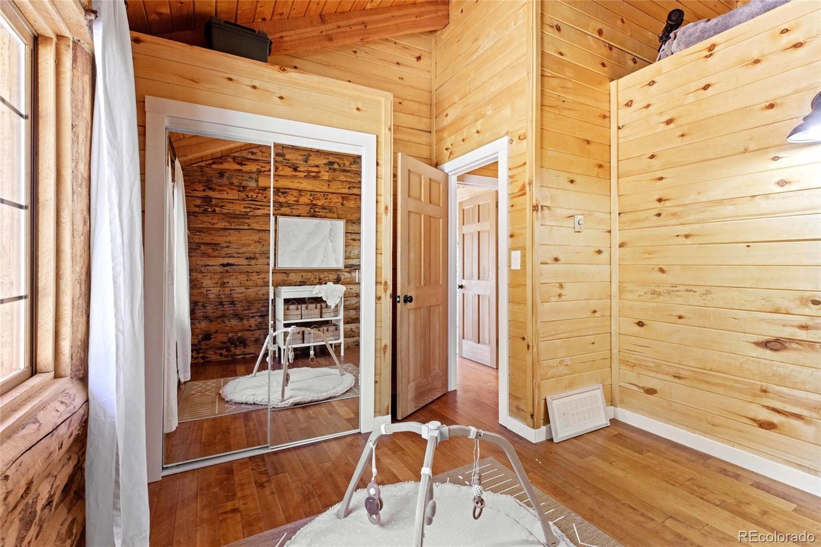 310 Holmes Gulch Road Bailey, CO 80421 - Photo 16 of 48 walk in closet with wooden floor