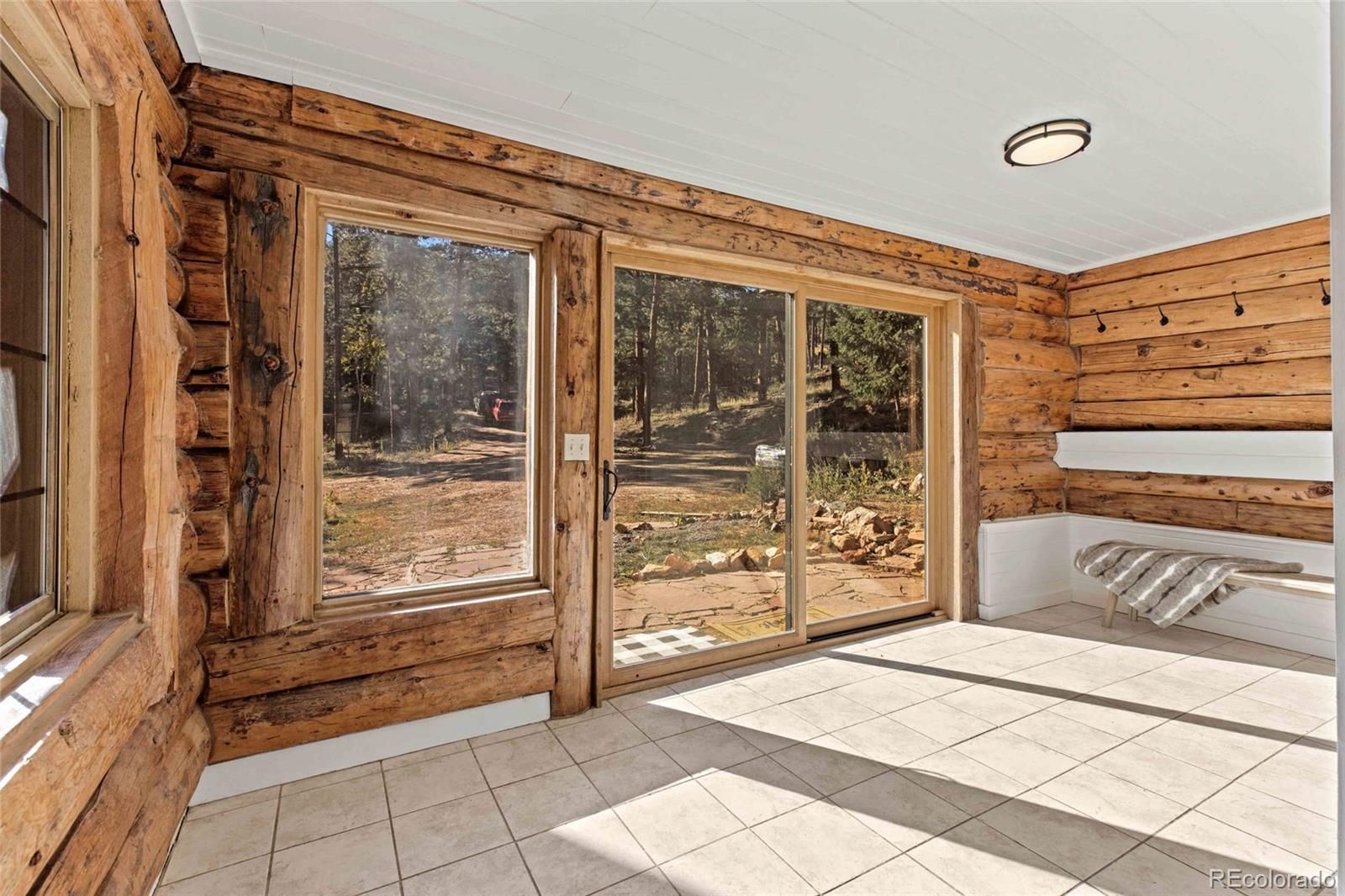 310 Holmes Gulch Road Bailey, CO 80421 - Photo 23 of 48 a view of a entryway door of the house