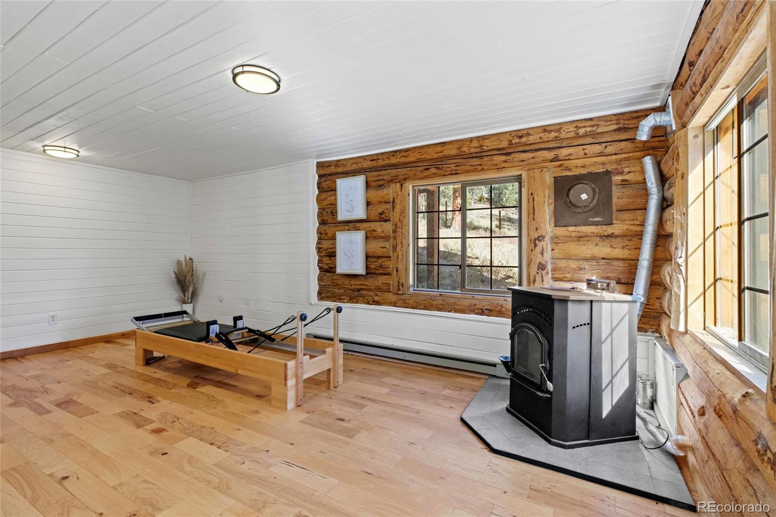 310 Holmes Gulch Road Bailey, CO 80421 - Photo 24 of 48 a living room with furniture window and a table