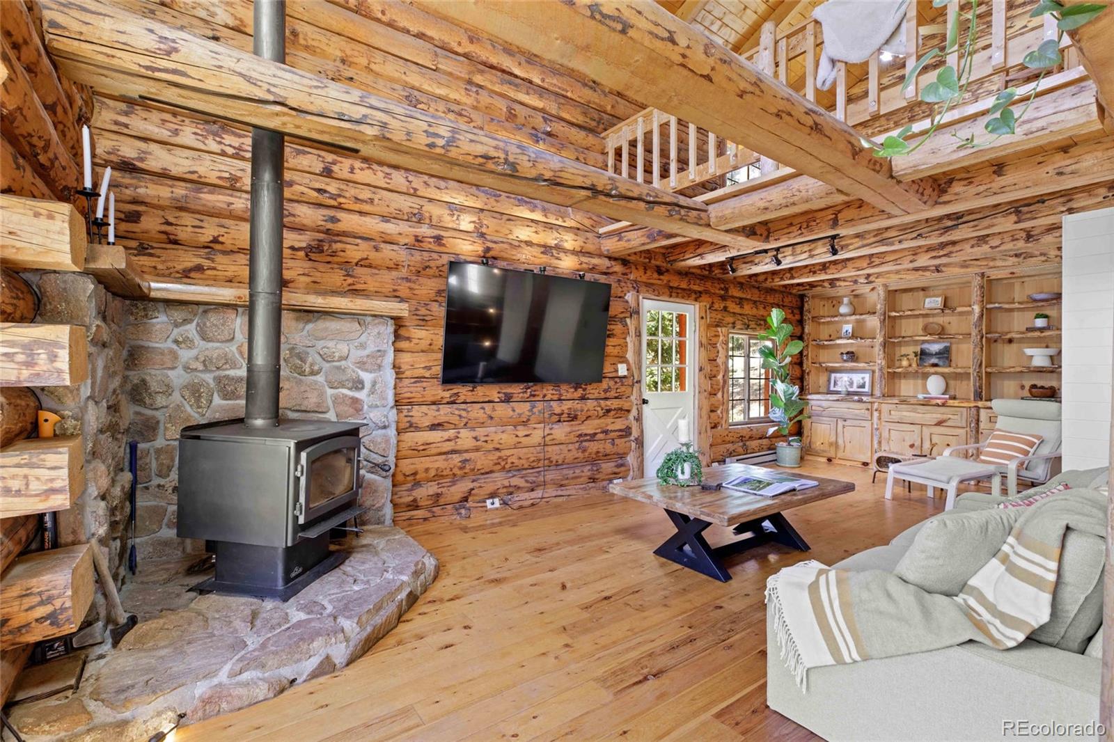 310 Holmes Gulch Road Bailey, CO 80421 - Photo 3 of 48 a outdoor living space with patio furniture