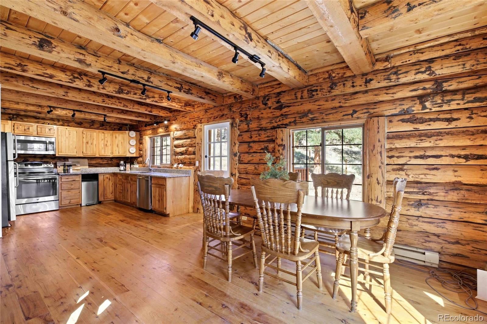 310 Holmes Gulch Road Bailey, CO 80421 - Photo 6 of 48 a view of a kitchen with furniture and a kitchen view