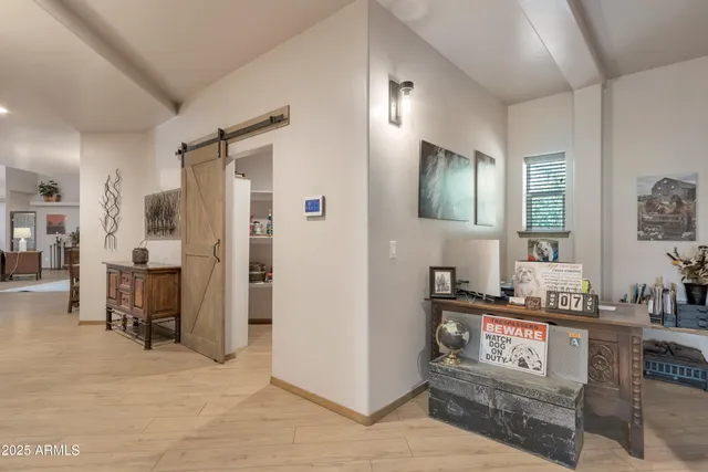 a living room with furniture and a table