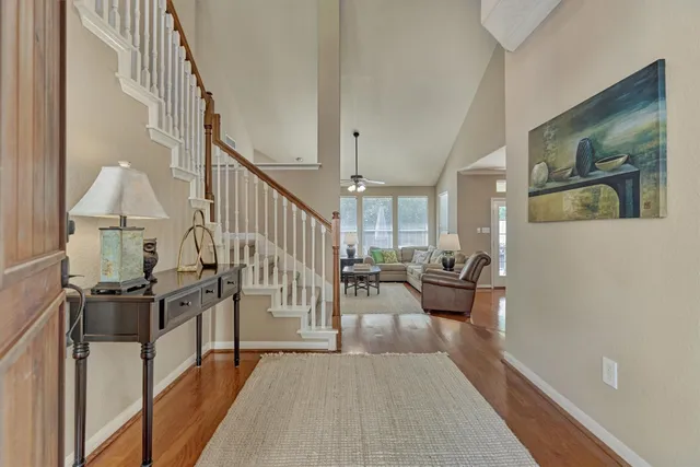 a view of a living room and hardwood floor