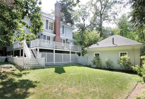 18 Spooner Road Brookline, MA 02467 - Photo 7 of 7 a front view of a house with a garden