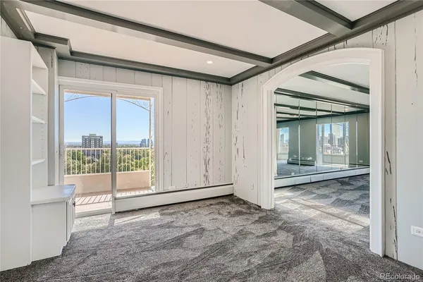 a view of an empty room with a window