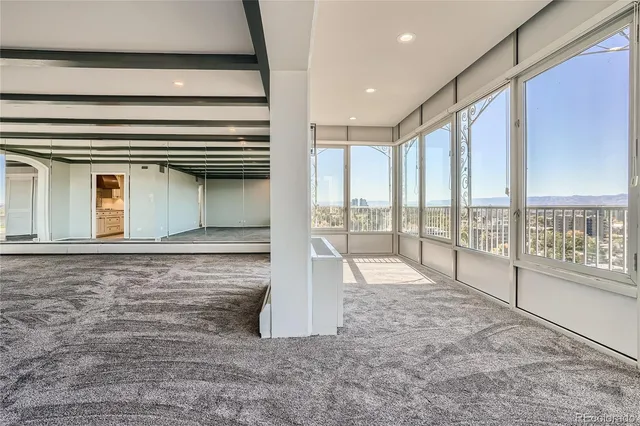 a view of an empty room with a window