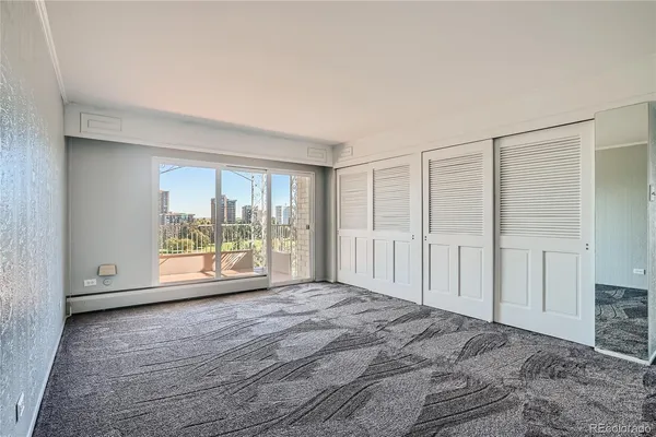a view of an empty room with a window