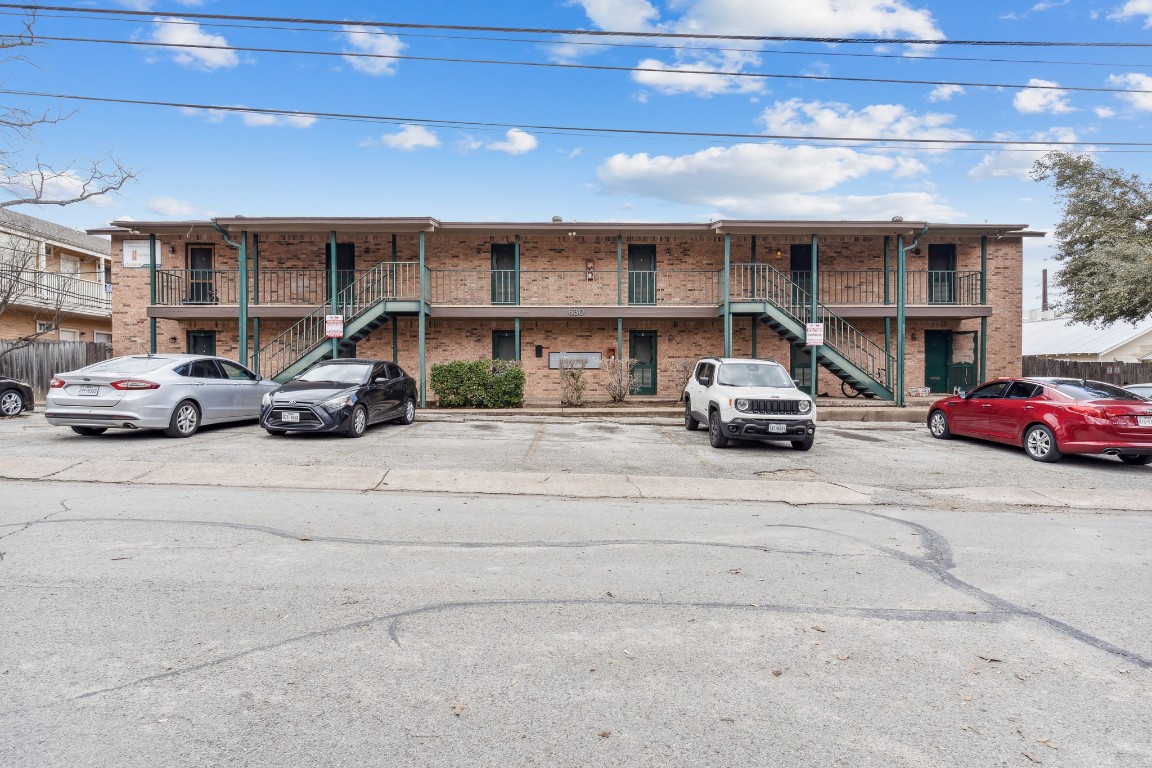a view of a car parked in front of a building