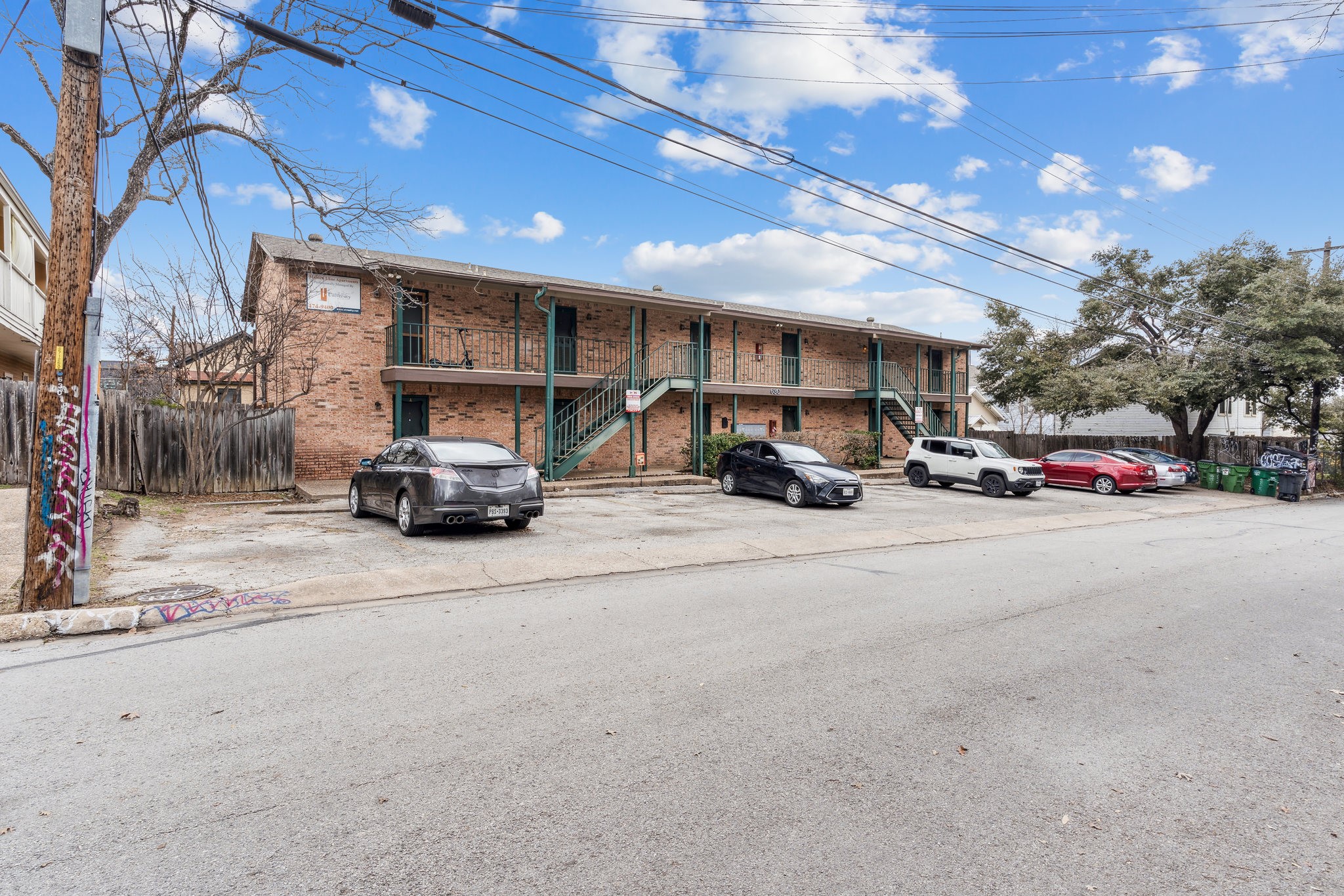 630 Maiden Lane, Unit K Austin, TX 78705 - Photo 14 of 15 a car parked in front of garage
