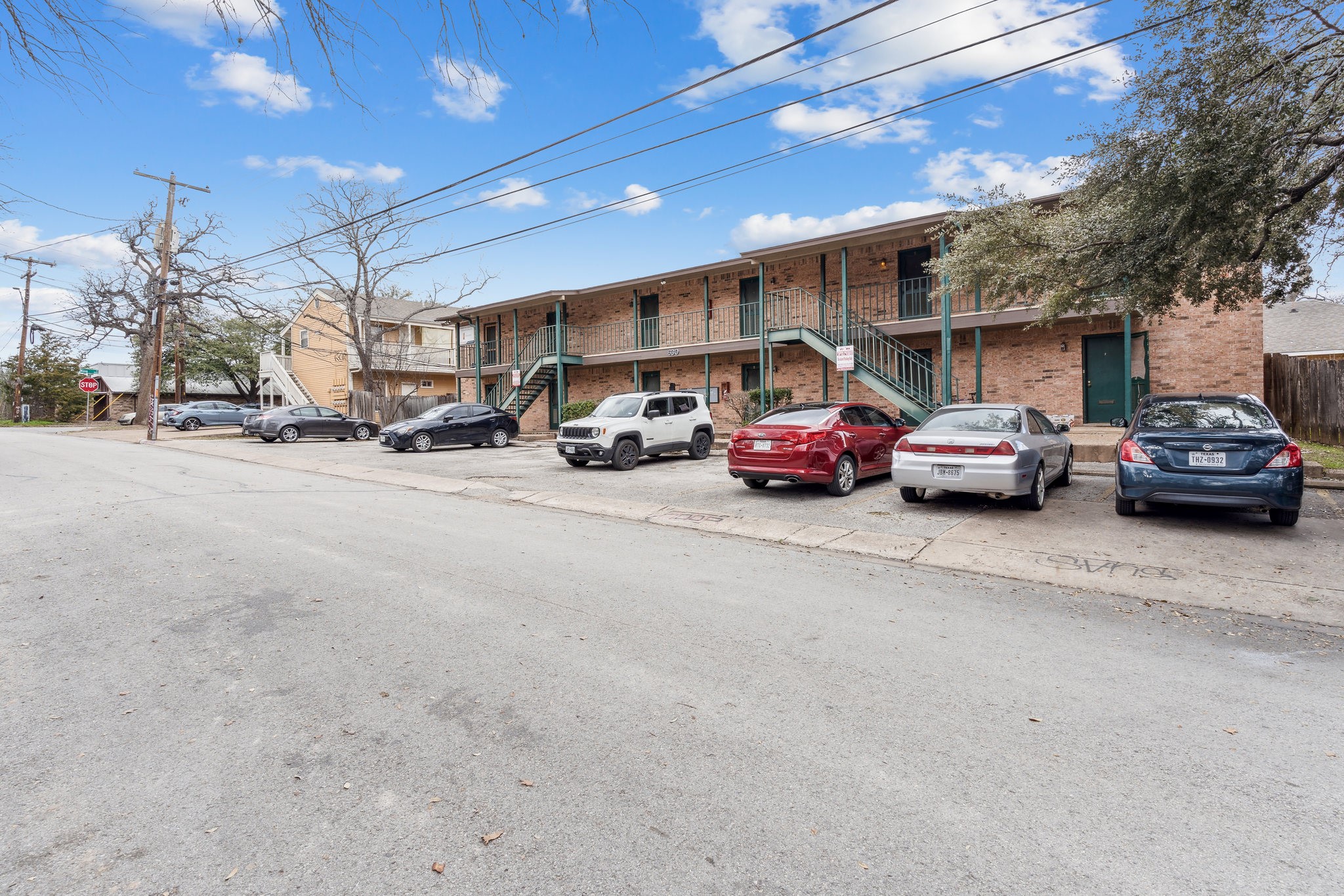 630 Maiden Lane, Unit K Austin, TX 78705 - Photo 15 of 15 a view of a cars parked in front of a house