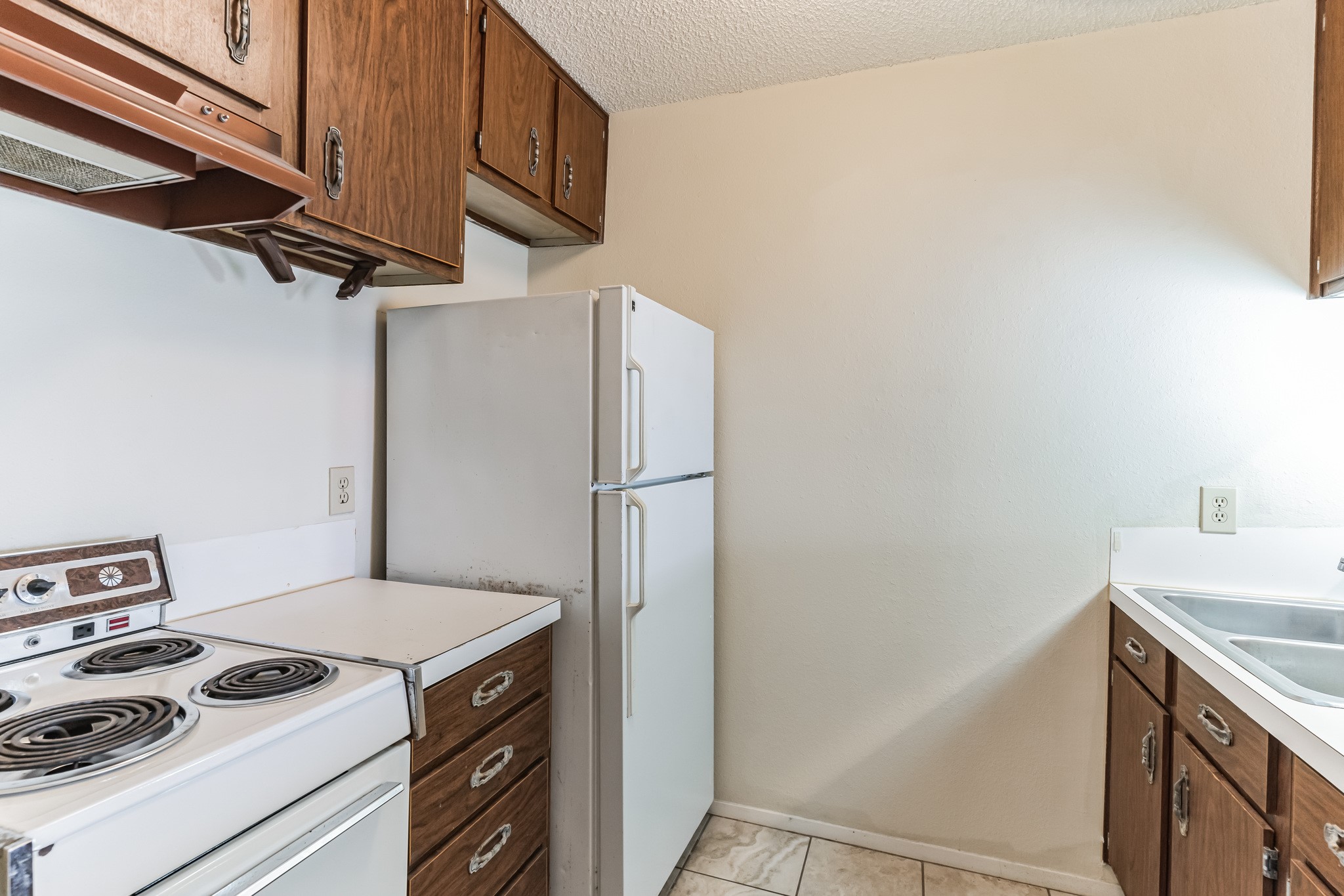 630 Maiden Lane, Unit K Austin, TX 78705 - Photo 8 of 15 a kitchen with stainless steel appliances granite countertop a refrigerator and a stove