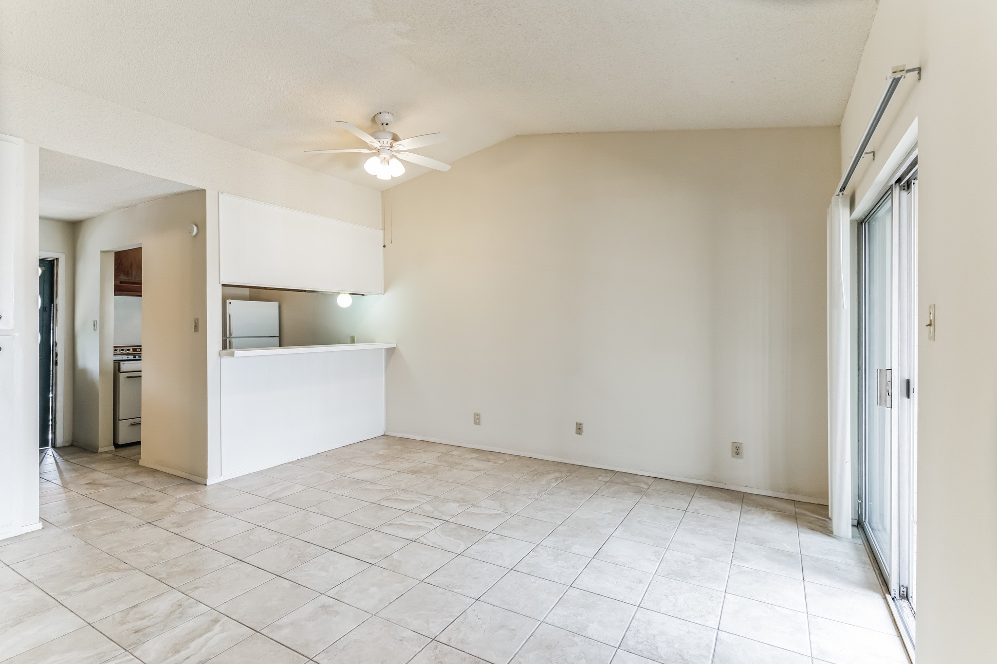 630 Maiden Lane, Unit K Austin, TX 78705 - Photo 9 of 15 an empty room with closet and a chandelier fan