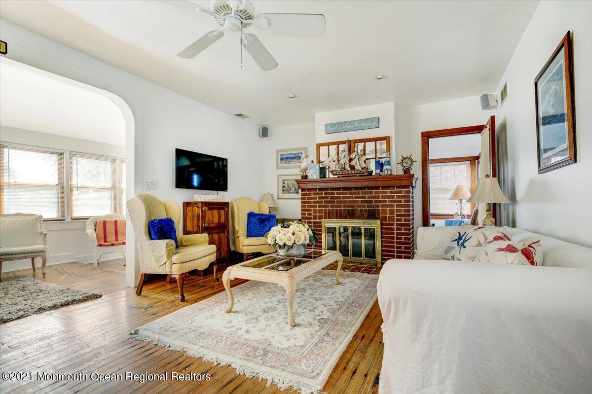 15 Riverview Road Monmouth Beach, NJ 07750 - Photo 2 of 38 a living room with fireplace furniture and a flat screen tv