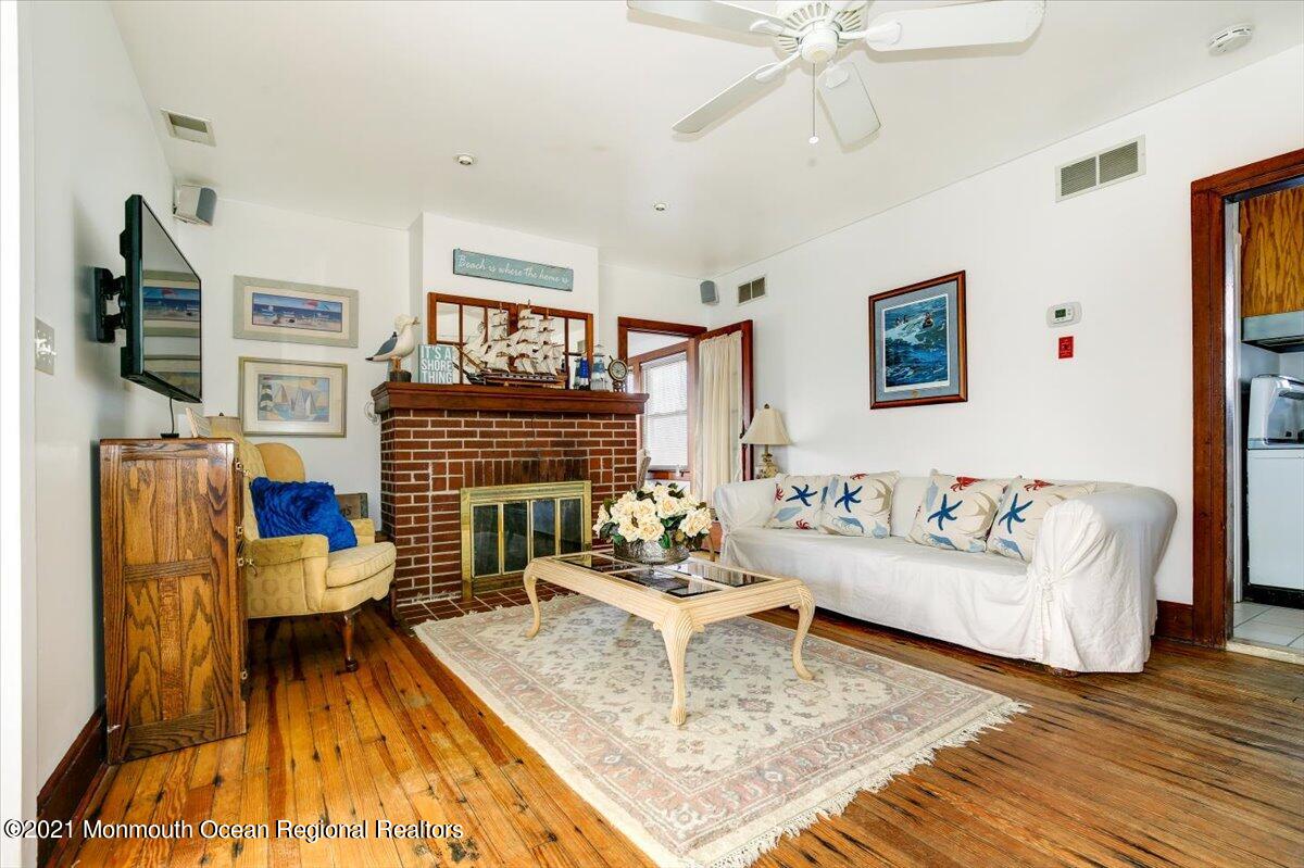 15 Riverview Road Monmouth Beach, NJ 07750 - Photo 3 of 38 a living room with furniture and a fireplace