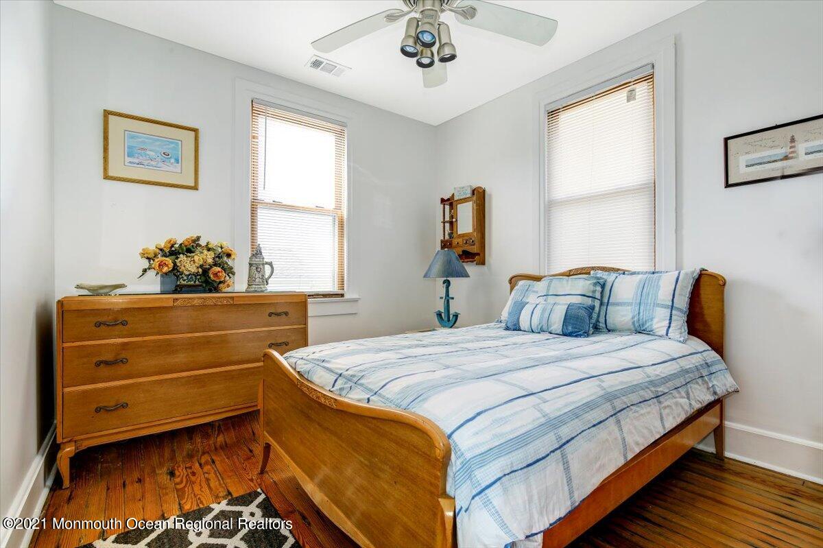 15 Riverview Road Monmouth Beach, NJ 07750 - Photo 36 of 38 a bedroom with a bed and window