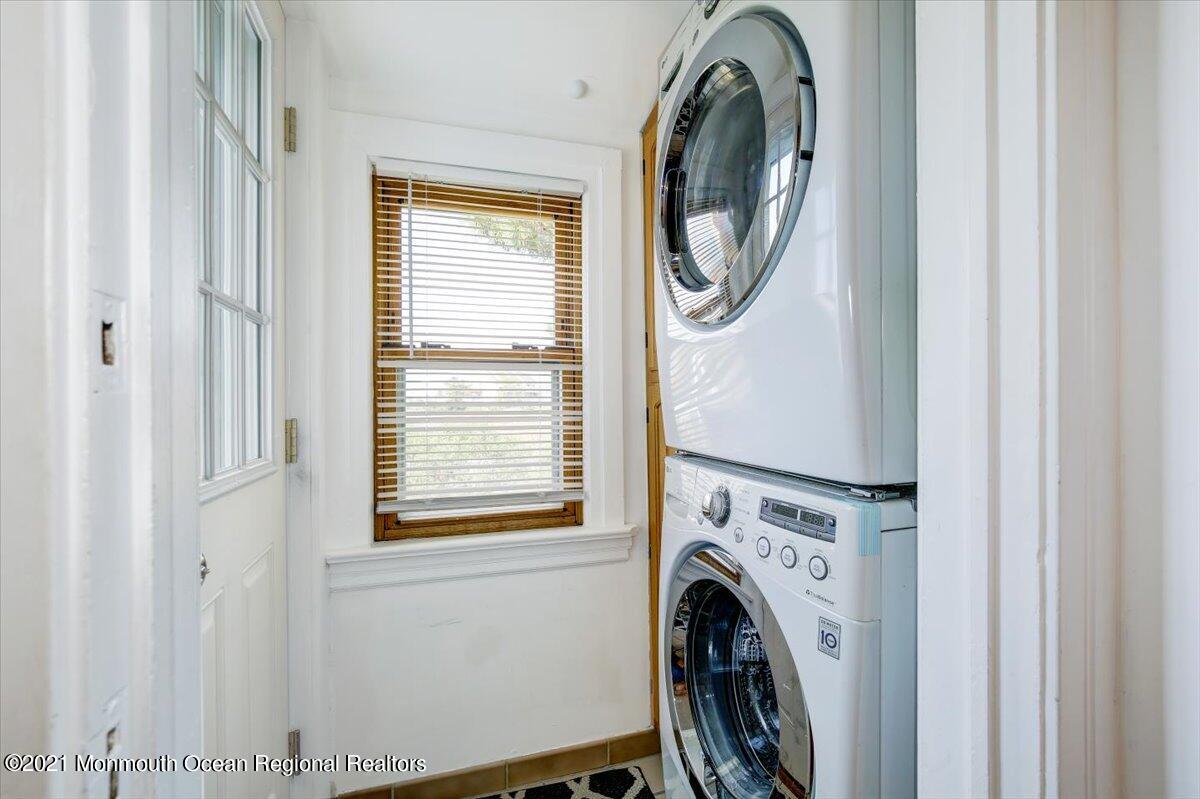 15 Riverview Road Monmouth Beach, NJ 07750 - Photo 9 of 38 a view of a bedroom with washer and dryer