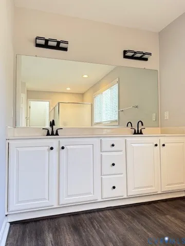 a bathroom with a bathtub and a shower