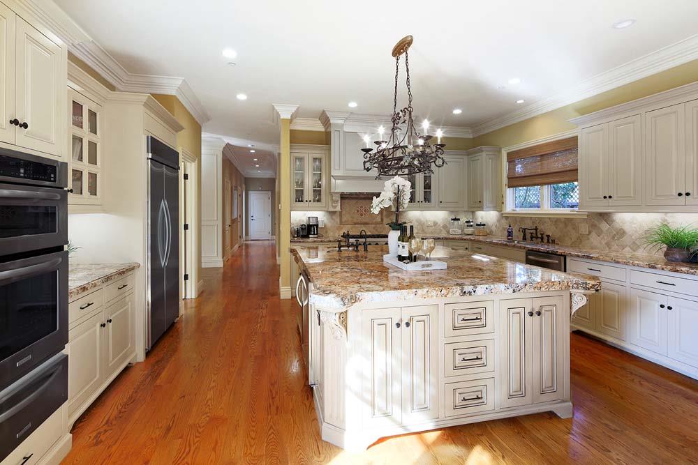 150 Newton Drive Burlingame, CA 94010 - Photo 16 of 58 a kitchen with stainless steel appliances kitchen island granite countertop a stove and a sink