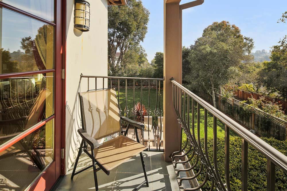 150 Newton Drive Burlingame, CA 94010 - Photo 35 of 58 a view of a balcony with wooden floor and fence