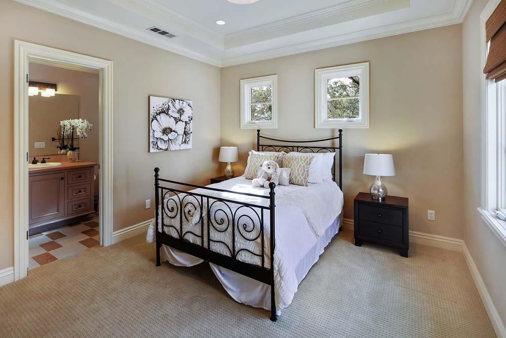 150 Newton Drive Burlingame, CA 94010 - Photo 36 of 58 a bedroom with bed and paintings on the wall