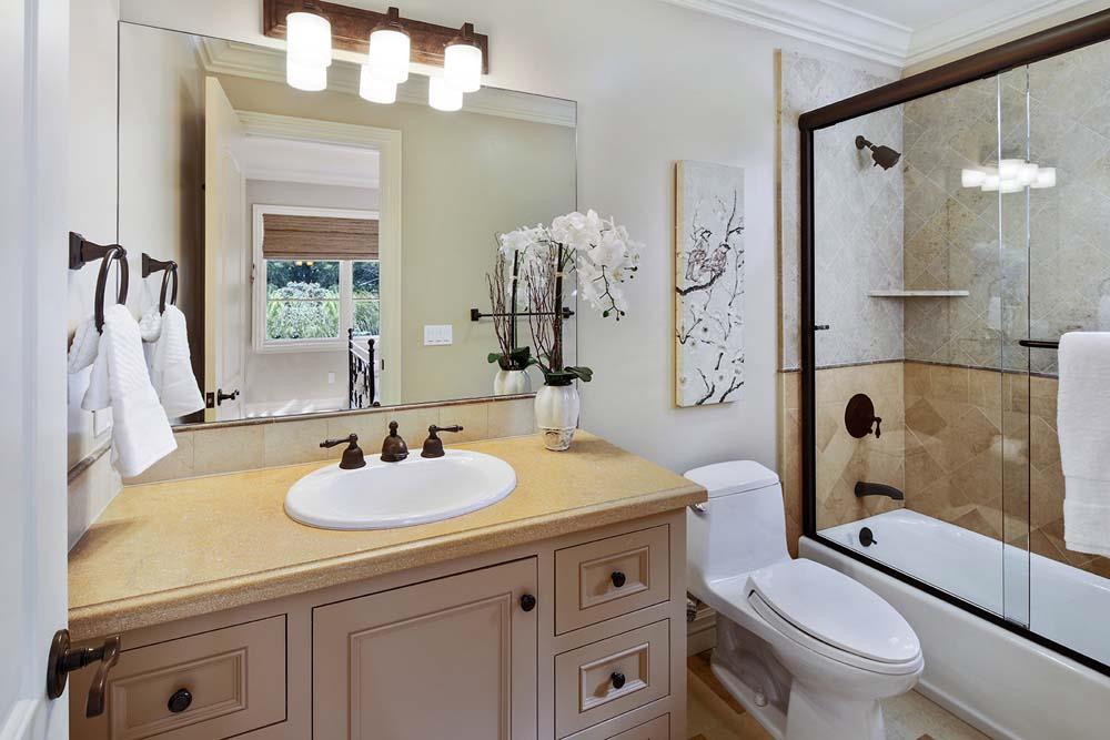 150 Newton Drive Burlingame, CA 94010 - Photo 38 of 58 a bathroom with a sink a toilet and shower