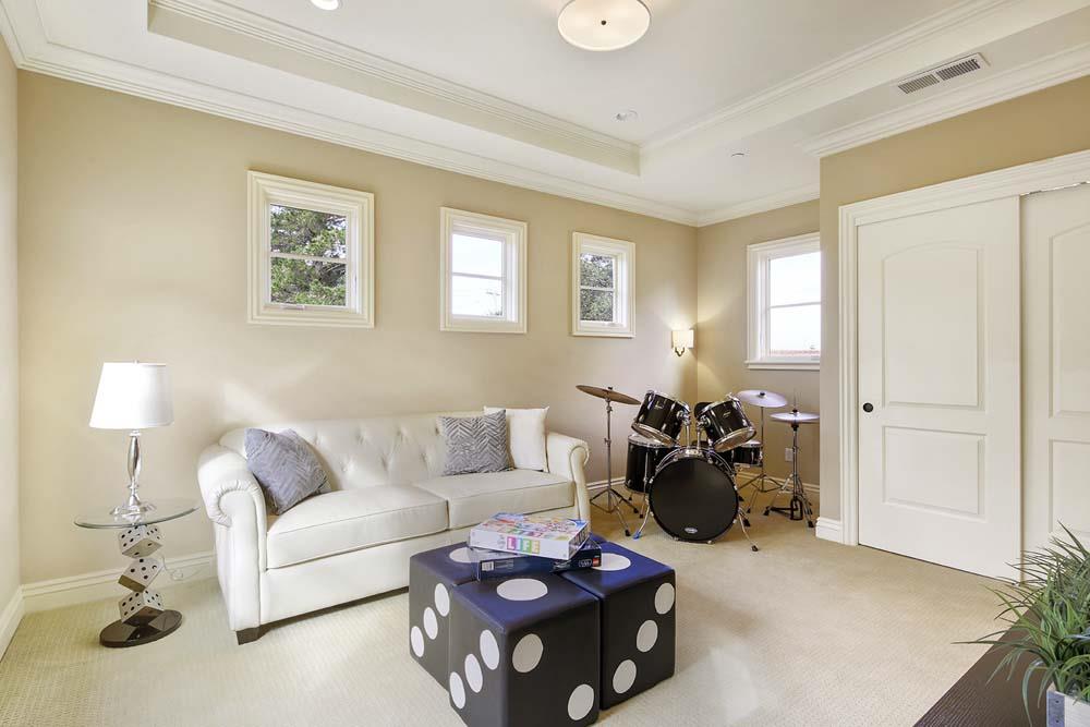 150 Newton Drive Burlingame, CA 94010 - Photo 45 of 58 a living room with furniture and a lamp