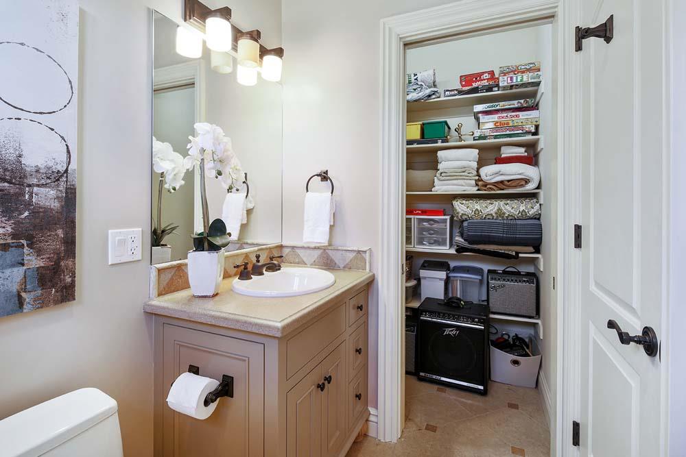 150 Newton Drive Burlingame, CA 94010 - Photo 48 of 58 a bathroom with a sink vanity and a mirror