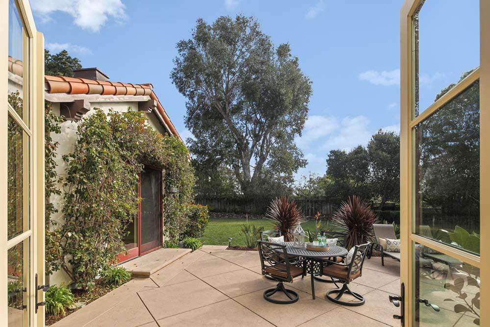 150 Newton Drive Burlingame, CA 94010 - Photo 53 of 58 a backyard of a house with a garden and outdoor seating