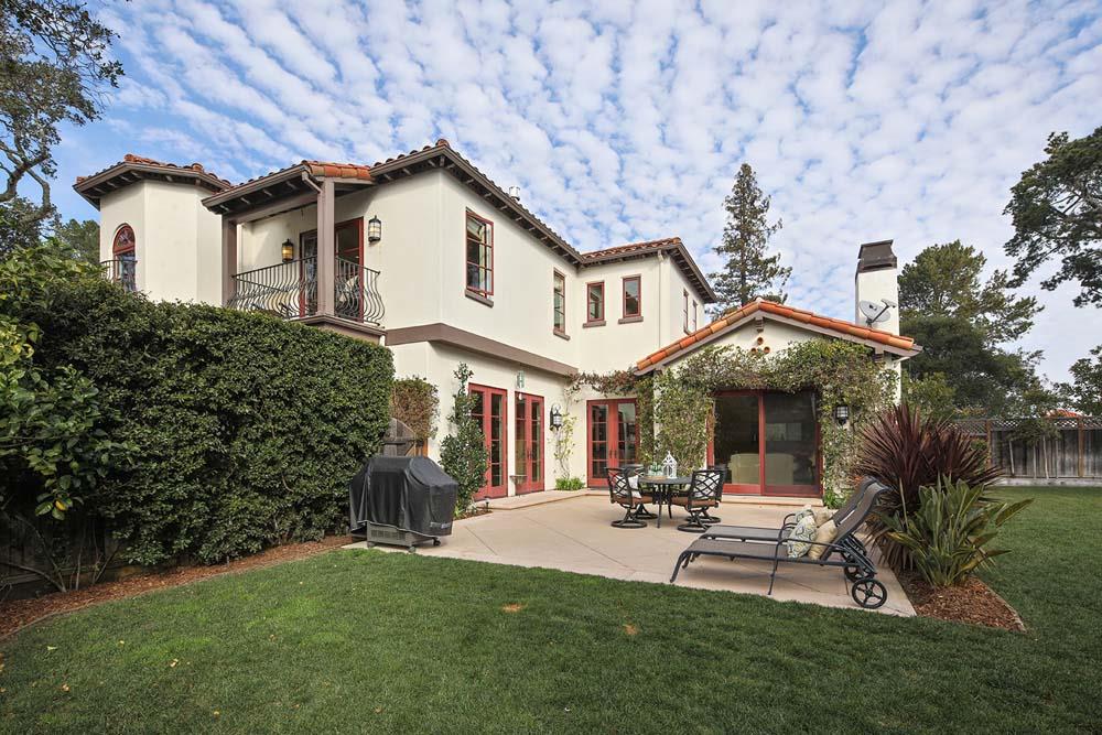 150 Newton Drive Burlingame, CA 94010 - Photo 57 of 58 a patio with a table and chairs under an umbrella