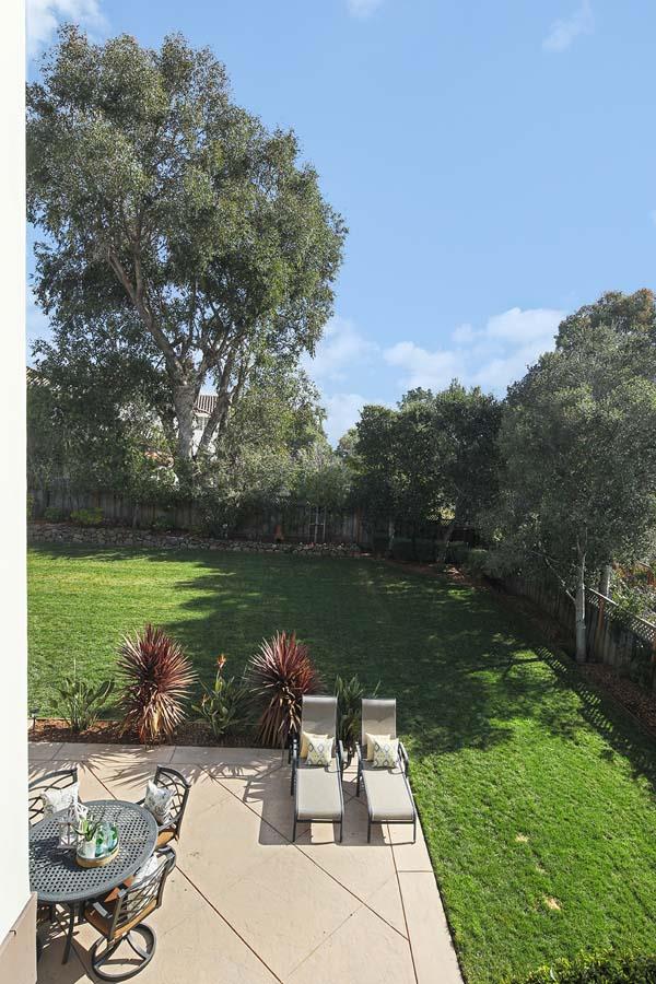 150 Newton Drive Burlingame, CA 94010 - Photo 58 of 58 a view of a lake with a yard and a patio