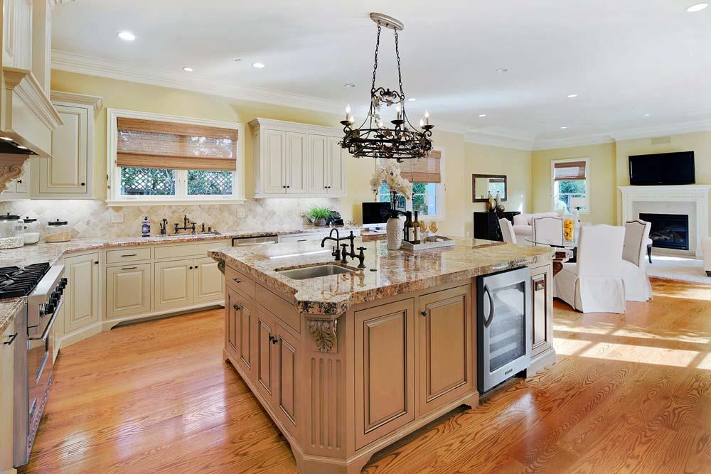 150 Newton Drive Burlingame, CA 94010 - Photo 8 of 58 a kitchen with kitchen island granite countertop a sink counter top space appliances and cabinets