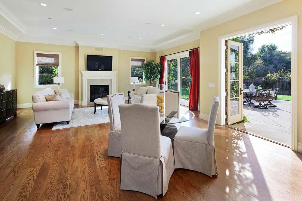 150 Newton Drive Burlingame, CA 94010 - Photo 9 of 58 a living room with furniture fireplace and floor to ceiling windows