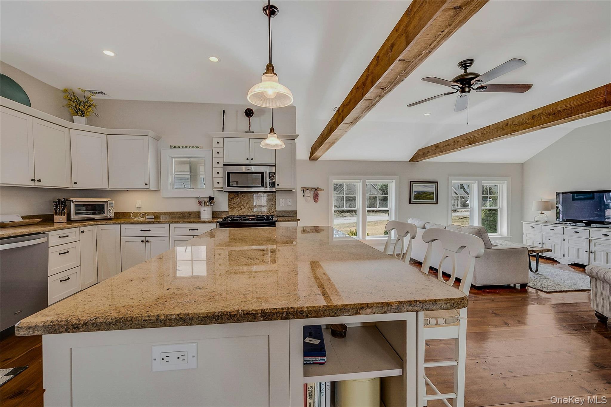 635 Strohson Road Cutchogue, NY 11935 - Photo 14 of 32 a kitchen with stainless steel appliances granite countertop a stove sink and cabinets