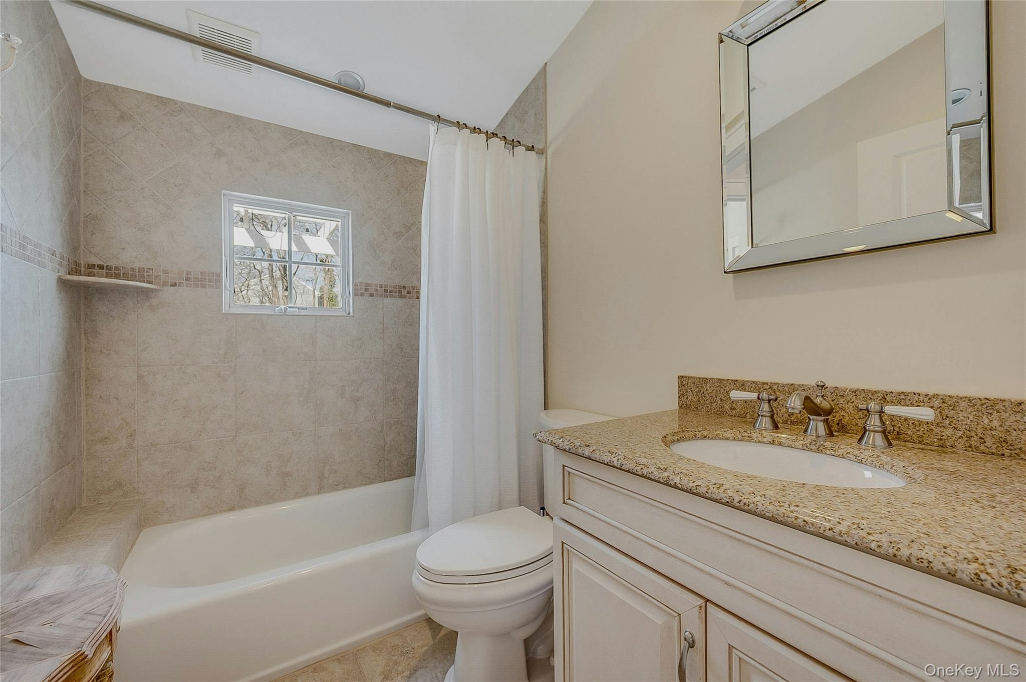 635 Strohson Road Cutchogue, NY 11935 - Photo 22 of 32 a bathroom with a granite countertop sink toilet and shower