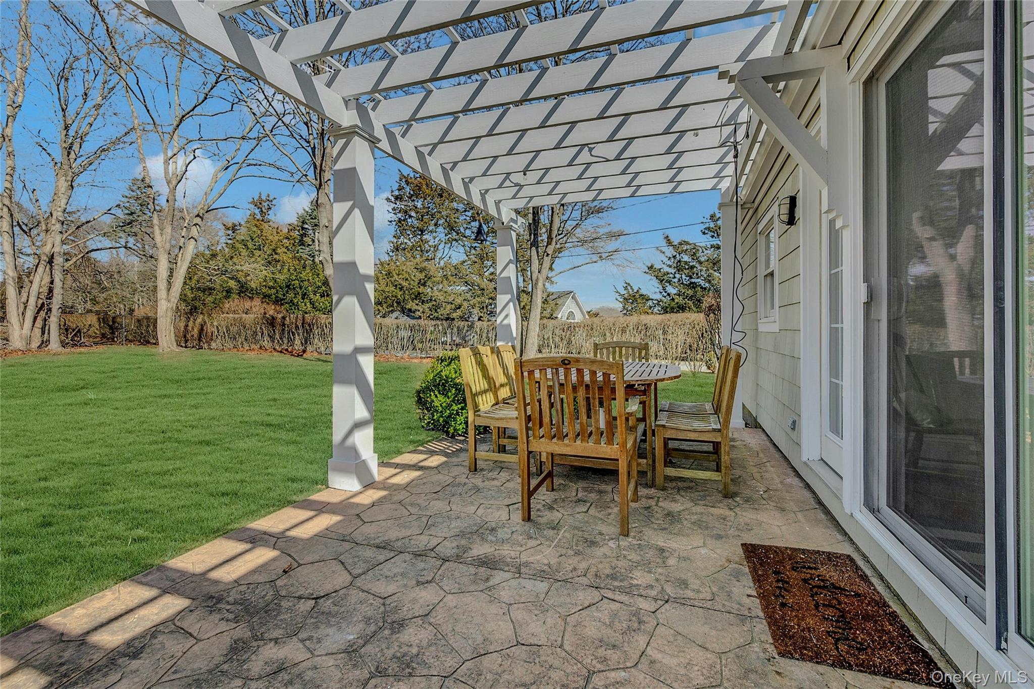 635 Strohson Road Cutchogue, NY 11935 - Photo 24 of 32 a view of a chairs and bench in the garden